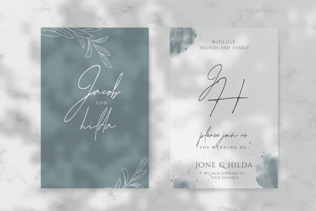 Sage green minimalist wedding invitation with calligraphy and botanical watercolor design