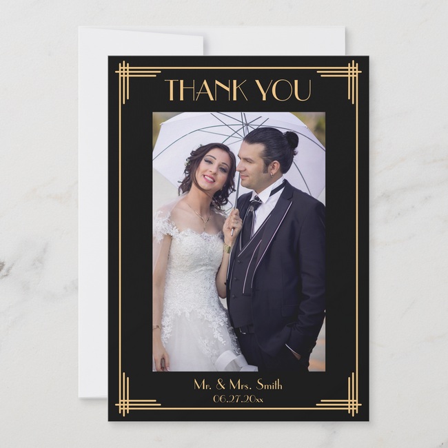 Black and gold art deco wedding thank you card featuring a bride and groom under a white umbrella, with elegant geometric border accents.
