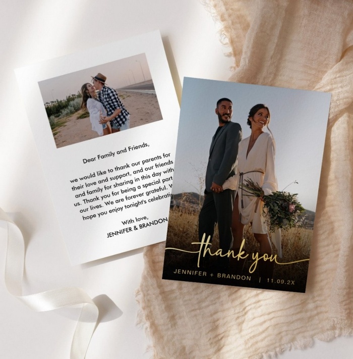 Wedding thank you card with gold foil calligraphy and couple’s photo on front, featuring a message and second photo on the back.