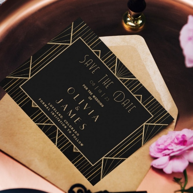 Elegant black and gold Art Deco Gatsby save the date card with geometric design and kraft envelope.