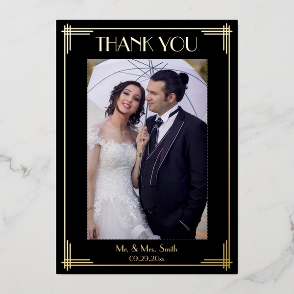 Art Deco wedding thank you card with real gold foil, black background, and couple’s photo framed in geometric border design.