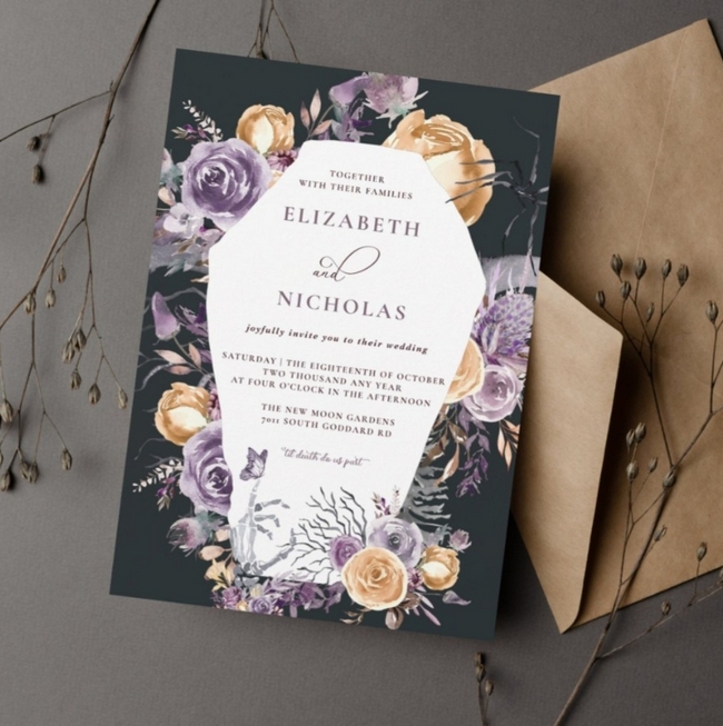 Elegant dark floral wedding invitation with gold and purple roses, featuring a white geometric frame for the couple’s names and event details, paired with a kraft envelope.
