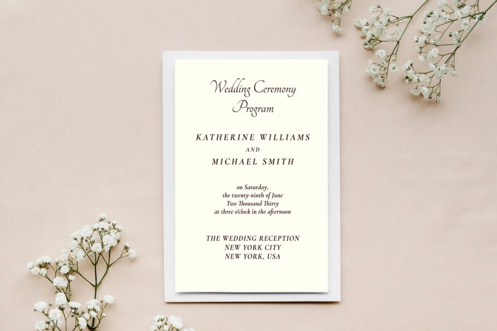 Elegant minimalist wedding program with black script font and floral accents, an example of wedding programs by theme.