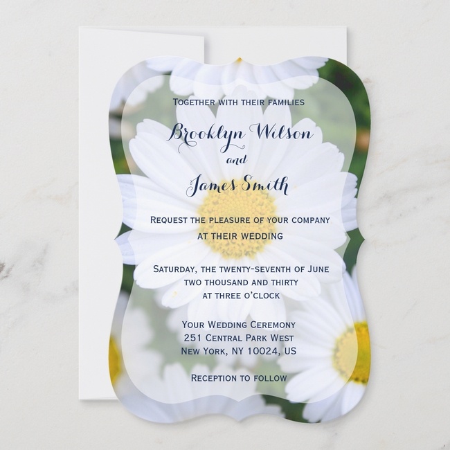 Unique floral wedding invitation with bold white daisy background and elegant script text on a shaped card design.