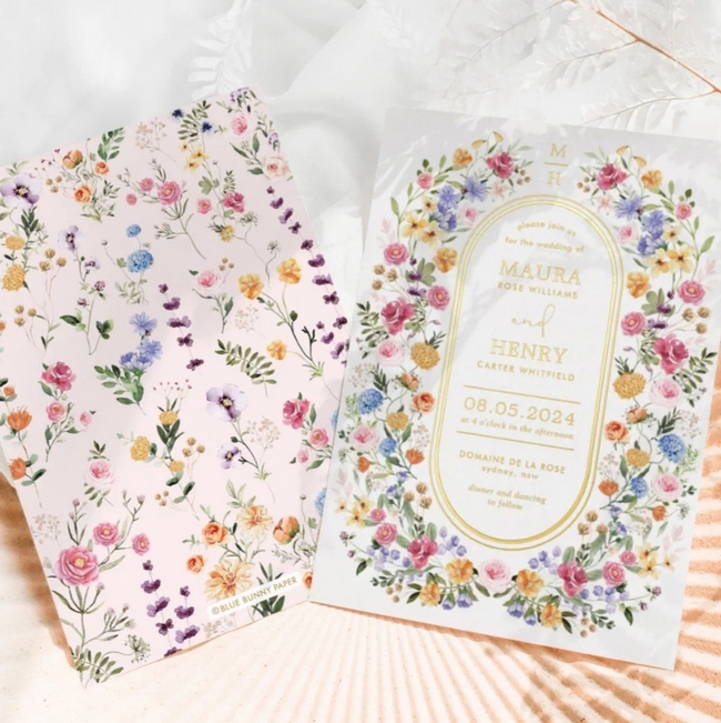 Colorful spring wildflower wedding invitation with floral envelope liner and gold foil details on elegant garden themed stationery